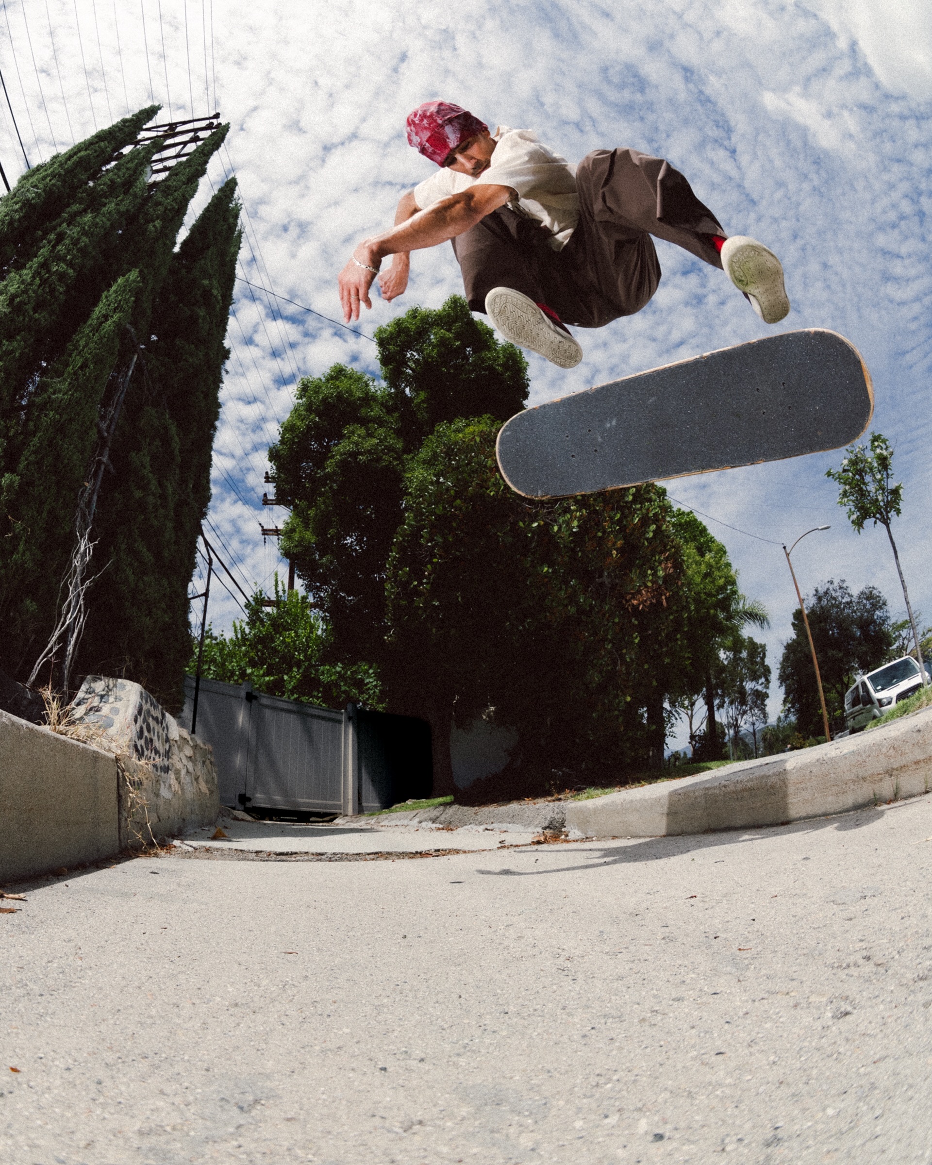 Skateboarder performing an aerial trick outdoors